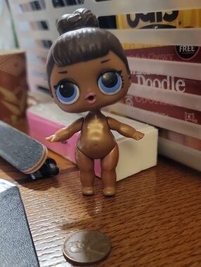 L.O.L. Surprise! Metallic Brown Doll with Blue Eyes and Pink Lips